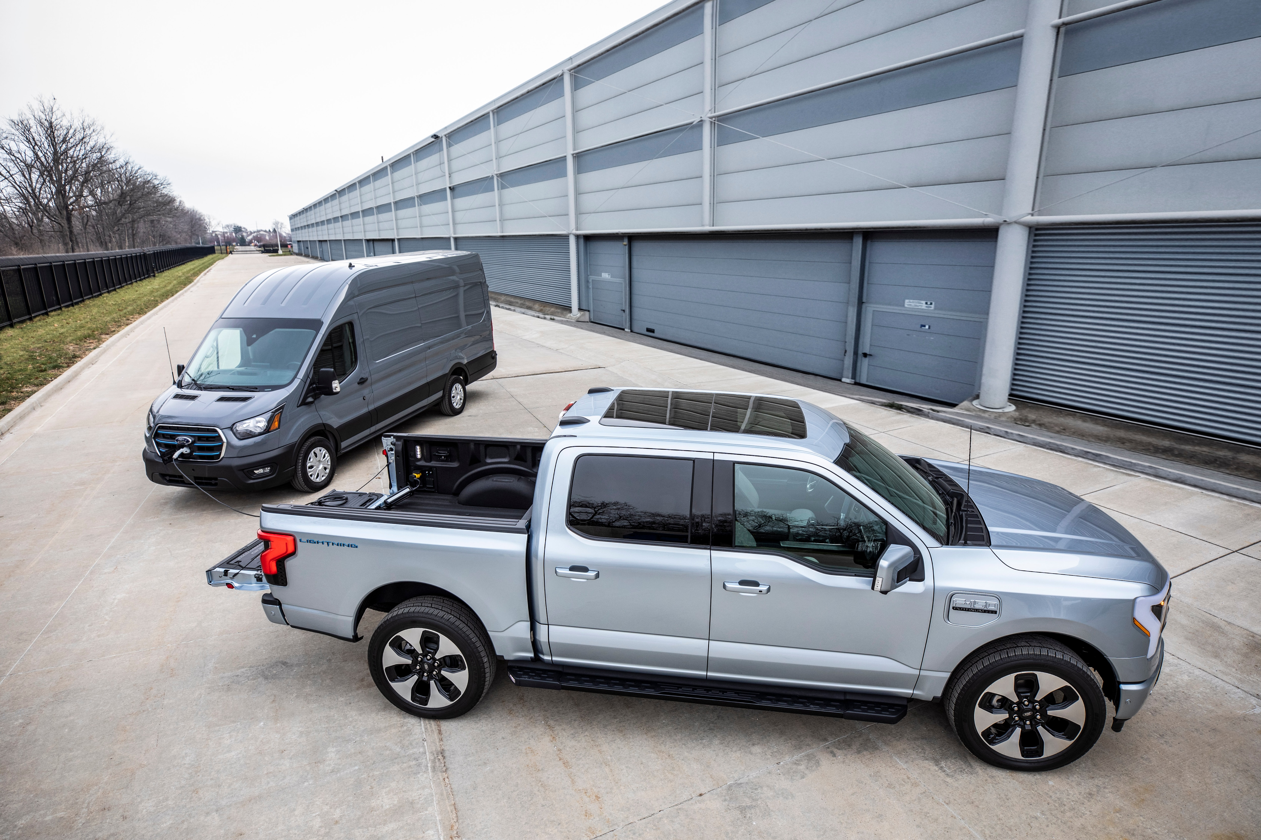 Aftermarket equipment shown. Ford E-Transit available early 2022. Preproduction Ford F-150 Lightning with optional equipment shown. Available starting spring 2022
